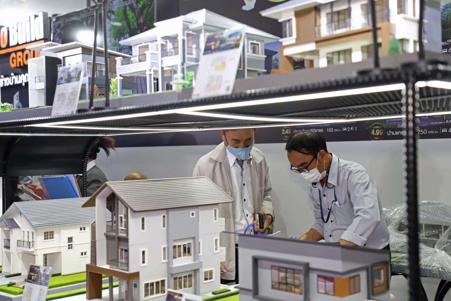 Miniature models of houses on display at a recent property fair. Mr Vichai said developers saw decreases in housing sales and transfers for several quarters due to lower purchasing power and weak demand. (Photo: Varuth Hirunyatheb)